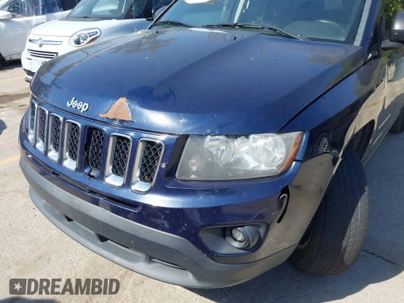2014 Jeep Compass Sport with VIN 1C4NJCBB0ED660610, listed as a IAAI auction lot 40506737 with 209,670 mi miles. Bid and sale history available at carsss.com. Image 6.