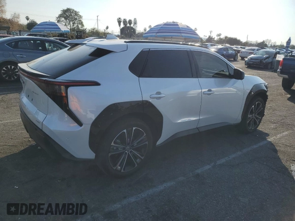 2024 Toyota bZ4X XLE with VIN JTMABACA6RA065029, listed as a Copart auction lot 43008655 with 15,489 mi miles and Salvage Title. Bid and sale history available at DreamBid. Image 3.