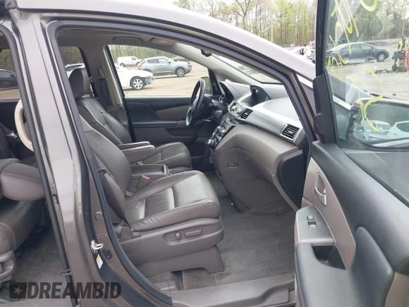 2013 Honda Odyssey Touring with VIN 5FNRL5H94DB013310, listed as a IAAI auction lot 42079565 with 128,622 mi miles and . Bid and sale history available at carsss.com. Image 5.