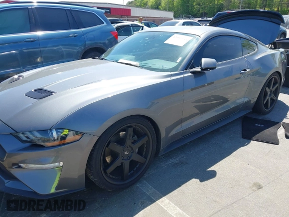 2021 Ford Mustang EcoBoost with VIN 1FA6P8TH3M5100601, listed as a IAAI auction lot 42060948 with 79,677 mi miles and . Bid and sale history available at DreamBid. Image 2.