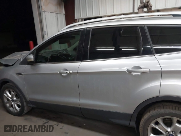 2015 Ford Escape Titanium with VIN 1FMCU0J96FUB81598, listed as a IAAI auction lot 41872114 with 122,001 mi miles and . Bid and sale history available at DreamBid. Image 14.