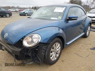 2019 Volkswagen Beetle S with VIN 3VWFD7AT8KM708865, listed as a IAAI auction lot 41692756 with 35,070 mi miles. Bid and sale history available at carsss.com. Image 2.