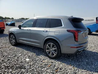 2021 Cadillac XT6 Premium Luxury z VIN 1GYKPCRS5MZ197527, wystawiony jako Copart lot #55952185 z przebiegiem 24 856 mil mil oraz Szkody całkowita. Historia ofert i sprzedaży dostępna na DreamBid. Obrazek 2.