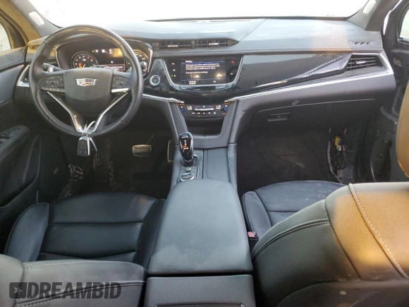 2023 Cadillac XT6 AWD Sport z VIN 1GYKPGRS6PZ108561, wystawiony jako Copart lot #71052284 z przebiegiem 31 496 mil mil oraz Szkoda całkowita • Salvage title. Historia ofert i sprzedaży dostępna na DreamBid. Obrazek 8.