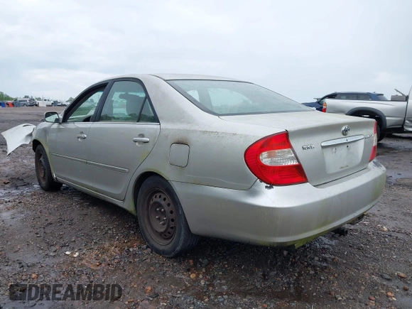 2003 Toyota Camry LE with VIN 4T1BE32K63U755835, listed as a IAAI auction lot 41976402 with 215,788 mi miles and . Bid and sale history available at DreamBid. Image 3.