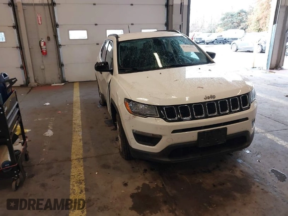 2018 Jeep Compass Sport with VIN 3C4NJCAB6JT124198, listed as a IAAI auction lot 41192196 with 104,557 mi miles. Bid and sale history available at carsss.com. Image 1.