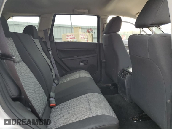 2009 Jeep Grand Cherokee Laredo with VIN 1J8GR48K89C500719, listed as a Copart auction lot 51425085 with 127,896 mi miles and Salvage Title. Bid and sale history available at carsss.com. Image 12.