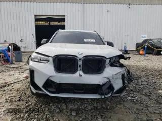 2022 BMW X3 M with VIN 5YM13EC0XN9J56822, listed as a Copart auction lot 49873974 with 7,396 mi miles and Salvage Title. Bid and sale history available at carsss.com. Image 5.