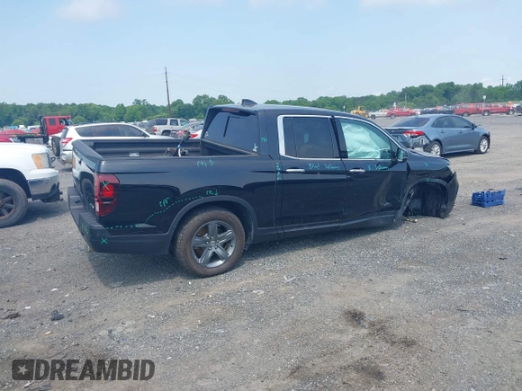 2023 Honda Ridgeline RTL-E with VIN 5FPYK3F71PB022739, listed as a IAAI auction lot 42447428 with 19,702 mi miles and . Bid and sale history available at DreamBid. Image 4.