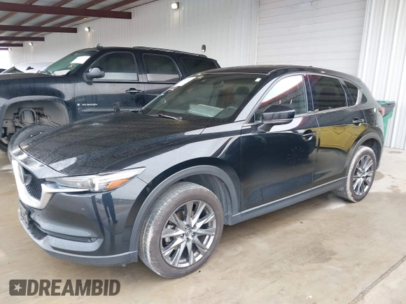 2021 Mazda CX-5 Signature with VIN JM3KFBEY5M0432033, listed as a IAAI auction lot 41607215 with 49,870 mi miles. Bid and sale history available at carsss.com. Image 17.