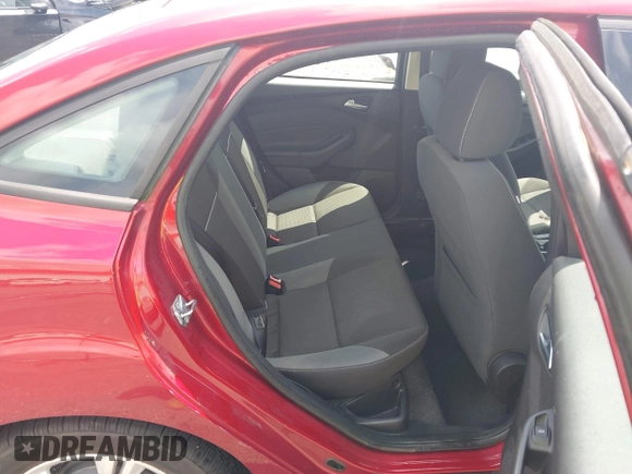 2013 Ford Focus SE z VIN 1FADP3F29DL149377, wystawiony jako IAAI lot #42472584 z przebiegiem 79 402 mil mil oraz . Historia ofert i sprzedaży dostępna na DreamBid. Obrazek 8.