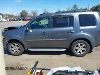 2011 Honda Pilot Touring with VIN 5FNYF4H95BB090892, listed as a IAAI auction lot 41878404 with 131,757 mi miles. Bid and sale history available at carsss.com. Image 14.