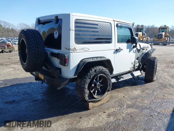2014 Jeep Wrangler Sport with VIN 1C4AJWAG0EL245337, listed as a IAAI auction lot 41532314 with 140,721 mi miles and . Bid and sale history available at DreamBid. Image 4.