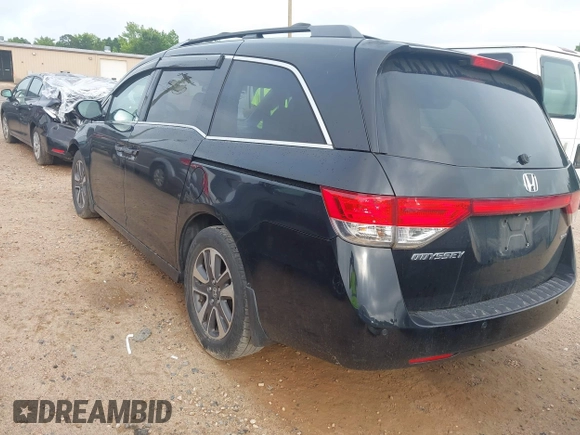 2015 Honda Odyssey Touring Elite with VIN 5FNRL5H90FB065004, listed as a IAAI auction lot 42461597 with 317,523 mi miles and . Bid and sale history available at DreamBid. Image 3.
