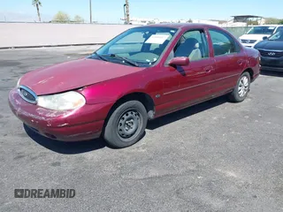 1999 Ford Contour z VIN 1FAFP6538XK117065, wystawiony jako IAAI lot #42088857 z przebiegiem 138 489 mil mil oraz . Historia ofert i sprzedaży dostępna na DreamBid. Obrazek 2.