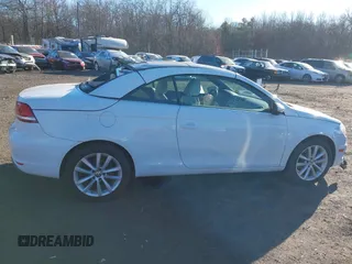 2015 Volkswagen Eos Komfort with VIN WVWBW8AH0FV001011, listed as a IAAI auction lot 41297299 with 81,444 mi miles and . Bid and sale history available at DreamBid. Image 13.