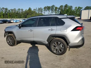 2024 Toyota RAV4 Hybrid XLE Premium z VIN 2T3B6RFV0RW074218, wystawiony jako Copart lot #56917295 z przebiegiem 14 969 mil mil oraz Szkoda całkowita • Salvage title. Historia ofert i sprzedaży dostępna na DreamBid. Obrazek 2.