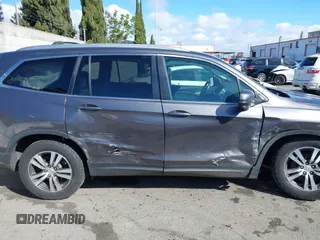 2017 Honda Pilot EX-L with VIN 5FNYF6H57HB021350, listed as a IAAI auction lot 41673635 with 101,980 mi miles and . Bid and sale history available at DreamBid. Image 13.