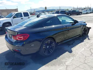 2015 BMW M4 with VIN WBS3R9C58FK334247, listed as a IAAI auction lot 41940211 with 125,881 mi miles. Bid and sale history available at carsss.com. Image 4.