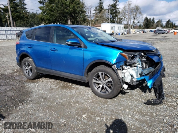 2018 Toyota RAV4 XLE with VIN 2T3RFREV3JW752934, listed as a Copart auction lot 48942015 with 74,182 mi miles and Salvage Title. Bid and sale history available at DreamBid. Image 4.