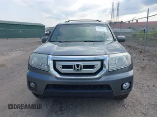2011 Honda Pilot Touring with VIN 5FNYF4H90BB103824, listed as a IAAI auction lot 42127137 with 243,858 mi miles and . Bid and sale history available at carsss.com. Image 12.