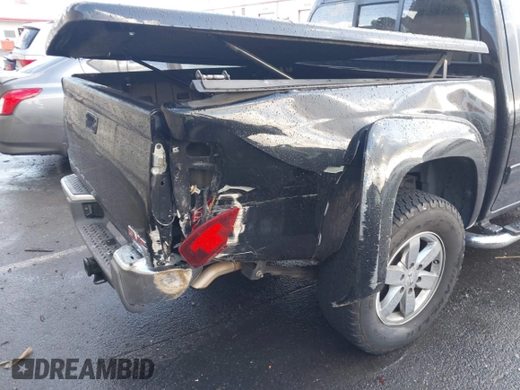 2010 GMC Canyon z VIN 1GTJSFDP6A8134412, wystawiony jako IAAI lot #41589150 z przebiegiem 164 232 mil mil oraz . Historia ofert i sprzedaży dostępna na DreamBid. Obrazek 6.