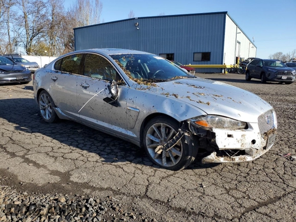 2015 Jaguar XF V6 Portfolio with VIN SAJWA0F7XF8U51105, listed as a Copart auction lot 82865814 with 62,807 mi miles and Salvage Title. Bid and sale history available at carsss.com. Image 4.