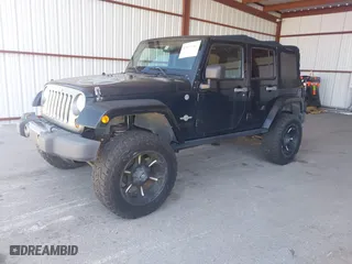 2013 Jeep Wrangler Unlimited Sport with VIN 1C4BJWDGXDL617166, listed as a IAAI auction lot 42037562 with 98,420 mi miles. Bid and sale history available at carsss.com. Image 17.