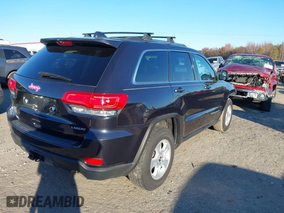 2014 Jeep Grand Cherokee Laredo with VIN 1C4RJEAG3EC218128, listed as a IAAI auction lot 40951611 with 119,596 mi miles and . Bid and sale history available at DreamBid. Image 4.