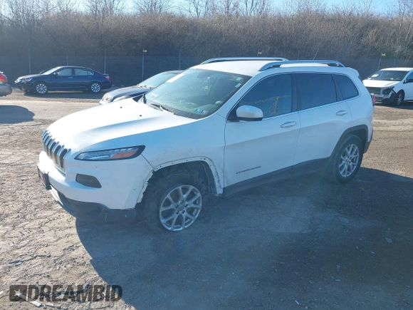 2015 Jeep Cherokee Latitude with VIN 1C4PJMCB3FW734573, listed as a IAAI auction lot 41825561 with 141,250 mi miles. Bid and sale history available at carsss.com. Image 18.