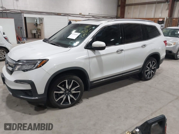 2022 Honda Pilot Touring 7-Passenger with VIN 5FNYF6H63NB063857, listed as a IAAI auction lot 41936941 with 54,424 mi miles. Bid and sale history available at carsss.com. Image 2.