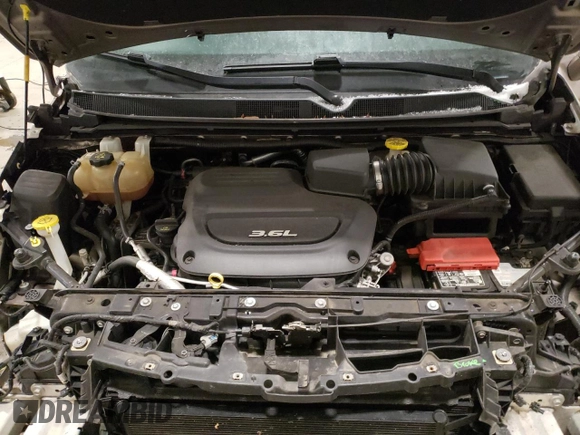 2018 Chrysler Pacifica Touring L z VIN 2C4RC1BGXJR153930, wystawiony jako Copart lot #88684735 z przebiegiem 64 822 mil mil oraz Szkoda całkowita • Salvage title. Historia ofert i sprzedaży dostępna na DreamBid. Obrazek 12.