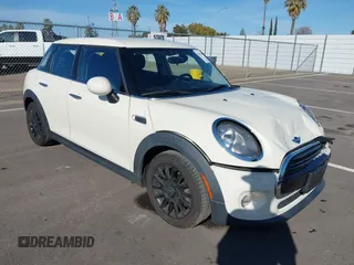 2018 MINI Hardtop 4 Door Cooper with VIN WMWXU1C58J2F80703, listed as a IAAI auction lot 41655964 with 65,760 mi miles and . Bid and sale history available at DreamBid. Image 1.