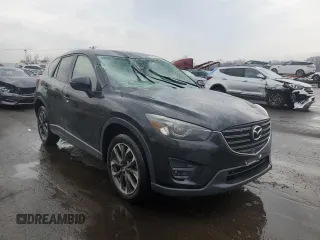 2016 Mazda CX-5 Grand Touring with VIN JM3KE4DYXG0711367, listed as a Copart auction lot 52862405 with 87,870 mi miles and Salvage Title. Bid and sale history available at DreamBid. Image 4.