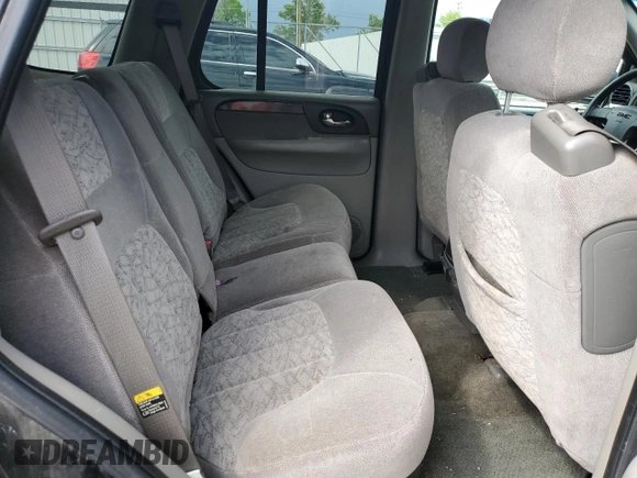 2003 GMC Envoy SLE z VIN 1GKDT13S432160651, wystawiony jako Copart lot #56938205 z przebiegiem 197 593 mil mil oraz Szkoda całkowita • Salvage title. Historia ofert i sprzedaży dostępna na DreamBid. Obrazek 11.