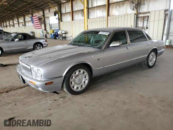 2000 Jaguar XJ with VIN SAJDA25B8YMF04079, listed as a Copart auction lot 50592595 with 131,647 mi miles and Salvage title. Bid and sale history available at DreamBid. Image 1.