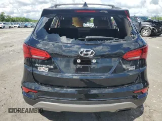 2017 Hyundai Santa Fe 2.4L z VIN 5NMZUDLB9HH013230, wystawiony jako Copart lot #55888975 z przebiegiem Nie podano mil oraz Szkoda całkowita • Salvage title. Historia ofert i sprzedaży dostępna na DreamBid. Obrazek 6.