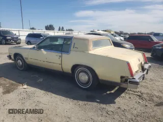 1982 Cadillac Eldorado z VIN 1G6AL578XCE608090, wystawiony jako Copart lot #73839654 z przebiegiem 22 185 mil mil oraz Czysty tytuł • Clean title. Historia ofert i sprzedaży dostępna na DreamBid. Obrazek 2.