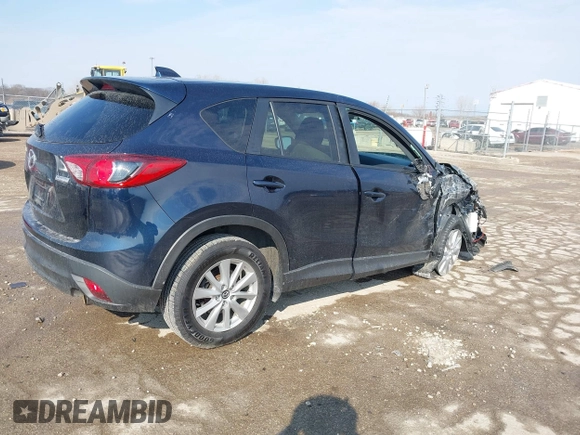 2015 Mazda CX-5 Touring with VIN JM3KE2CY0F0516589, listed as a IAAI auction lot 41707973 with 109,245 mi miles. Bid and sale history available at carsss.com. Image 4.
