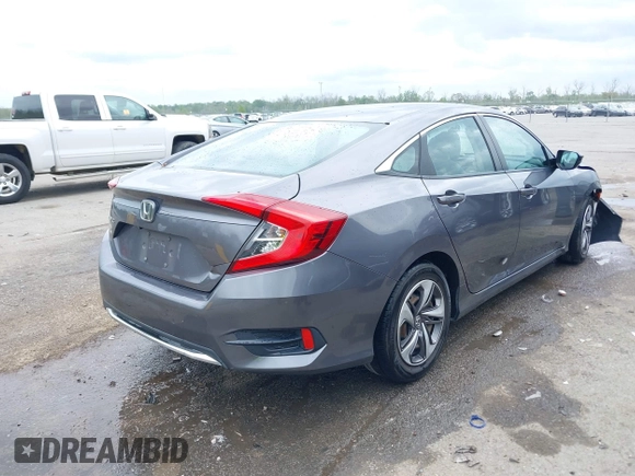 2019 Honda Civic LX with VIN 19XFC2F68KE007409, listed as a IAAI auction lot 41887406 with 57,147 mi miles and . Bid and sale history available at DreamBid. Image 4.