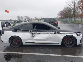 2018 Audi RS 5 z VIN WUAPWAF5XJA905043, wystawiony jako IAAI lot #41978868 z przebiegiem 60 838 mil mil oraz . Historia ofert i sprzedaży dostępna na DreamBid. Obrazek 13.