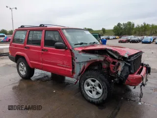 1999 Jeep Cherokee Sport with VIN 1J4FF68S2XL648735, listed as a Copart auction lot 58758115 with 252,248 mi miles and Salvage title. Bid and sale history available at DreamBid. Image 4.
