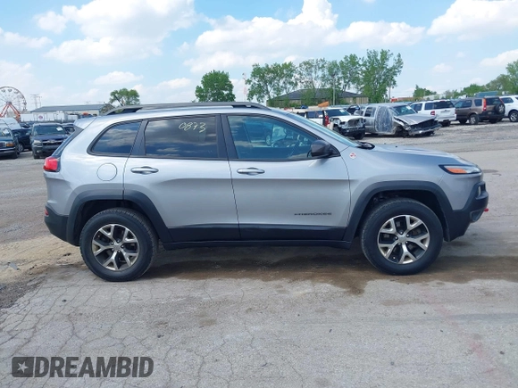 2015 Jeep Cherokee Trailhawk z VIN 1C4PJMBS5FW615313, wystawiony jako IAAI lot #42250873 z przebiegiem 148 008 mil mil oraz . Historia ofert i sprzedaży dostępna na DreamBid. Obrazek 13.