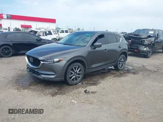 2018 Mazda CX-5 Touring with VIN JM3KFACM9J1348054, listed as a IAAI auction lot 42043458 with 120,177 mi miles. Bid and sale history available at carsss.com. Image 2.