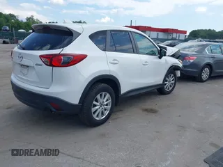 2014 Mazda CX-5 Touring z VIN JM3KE4CY9E0373359, wystawiony jako IAAI lot #42209277 z przebiegiem 106 493 mil mil oraz . Historia ofert i sprzedaży dostępna na DreamBid. Obrazek 4.