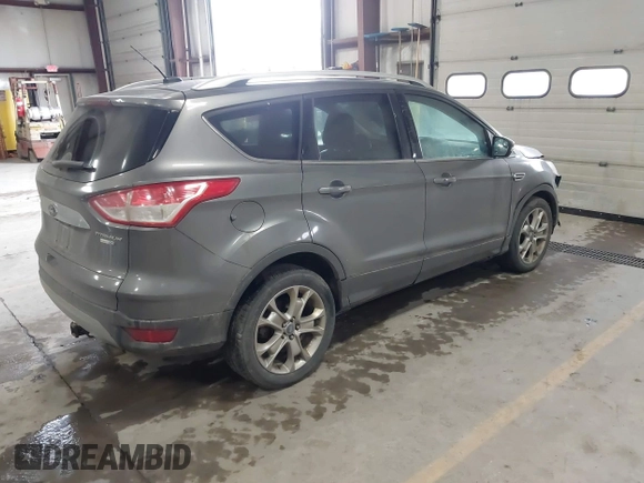 2014 Ford Escape Titanium with VIN 1FMCU9J90EUC31625, listed as a IAAI auction lot 41492075 with 301,917 mi miles and . Bid and sale history available at DreamBid. Image 4.