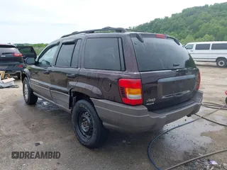 2004 Jeep Grand Cherokee Laredo z VIN 1J4GW48S94C209326, wystawiony jako IAAI lot #42309565 z przebiegiem 159 429 mil mil oraz . Historia ofert i sprzedaży dostępna na DreamBid. Obrazek 3.