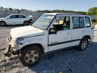 1997 Geo Tracker LSi z VIN 2CNBE1360V6927915, wystawiony jako Copart lot #53469605 z przebiegiem 119 413 mil mil oraz Szkody całkowita. Historia ofert i sprzedaży dostępna na DreamBid. Obrazek 1.