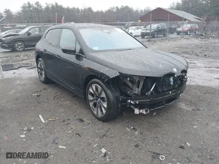 2024 BMW iX xDrive50 with VIN WB523CF00RCN76736, listed as a IAAI auction lot 41162938 with 21,575 mi miles. Bid and sale history available at carsss.com. Image 1.