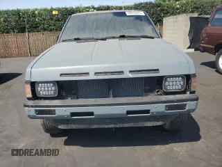 1990 Nissan Frontier with VIN 1N6SD11S9LC321876, listed as a Copart auction lot 59913575 with 119,909 mi miles and Salvage title. Bid and sale history available at DreamBid. Image 5.